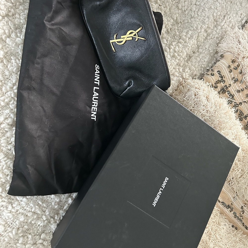 YSL belt bag. Used sparingly. Small amount of nail glue in the interior pocket.